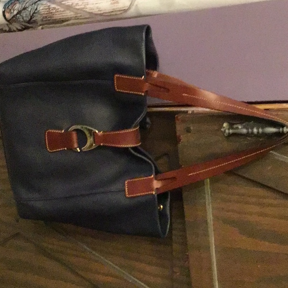 Navy leather Dooney and Bourke with brown trim and gold hardware